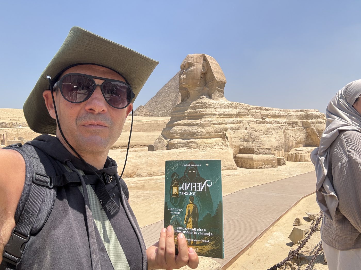 Giampiero with the book beside the Sphinx