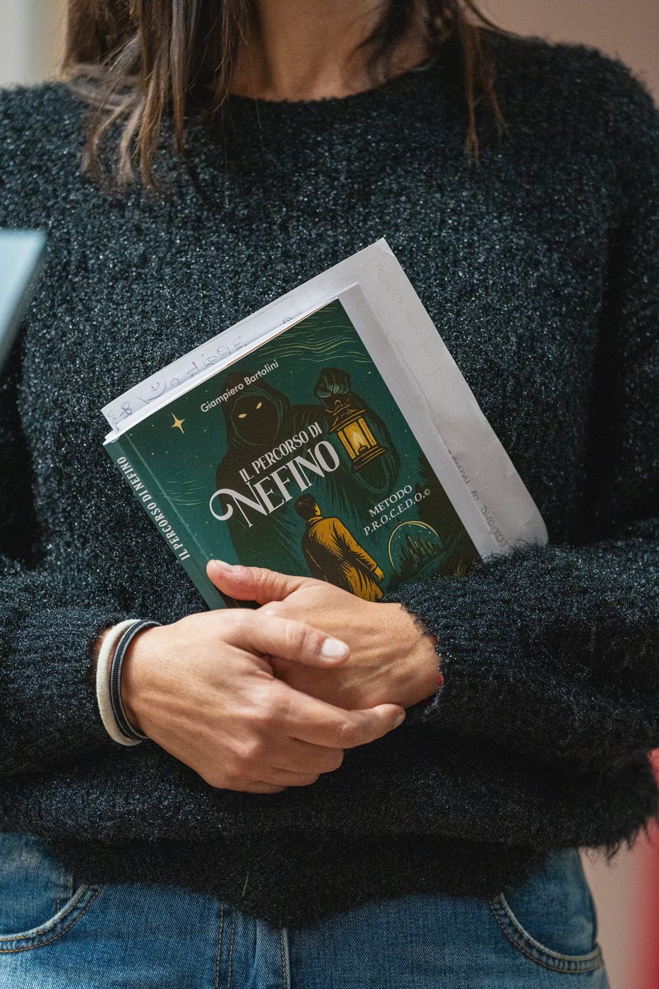 A reader holding the book